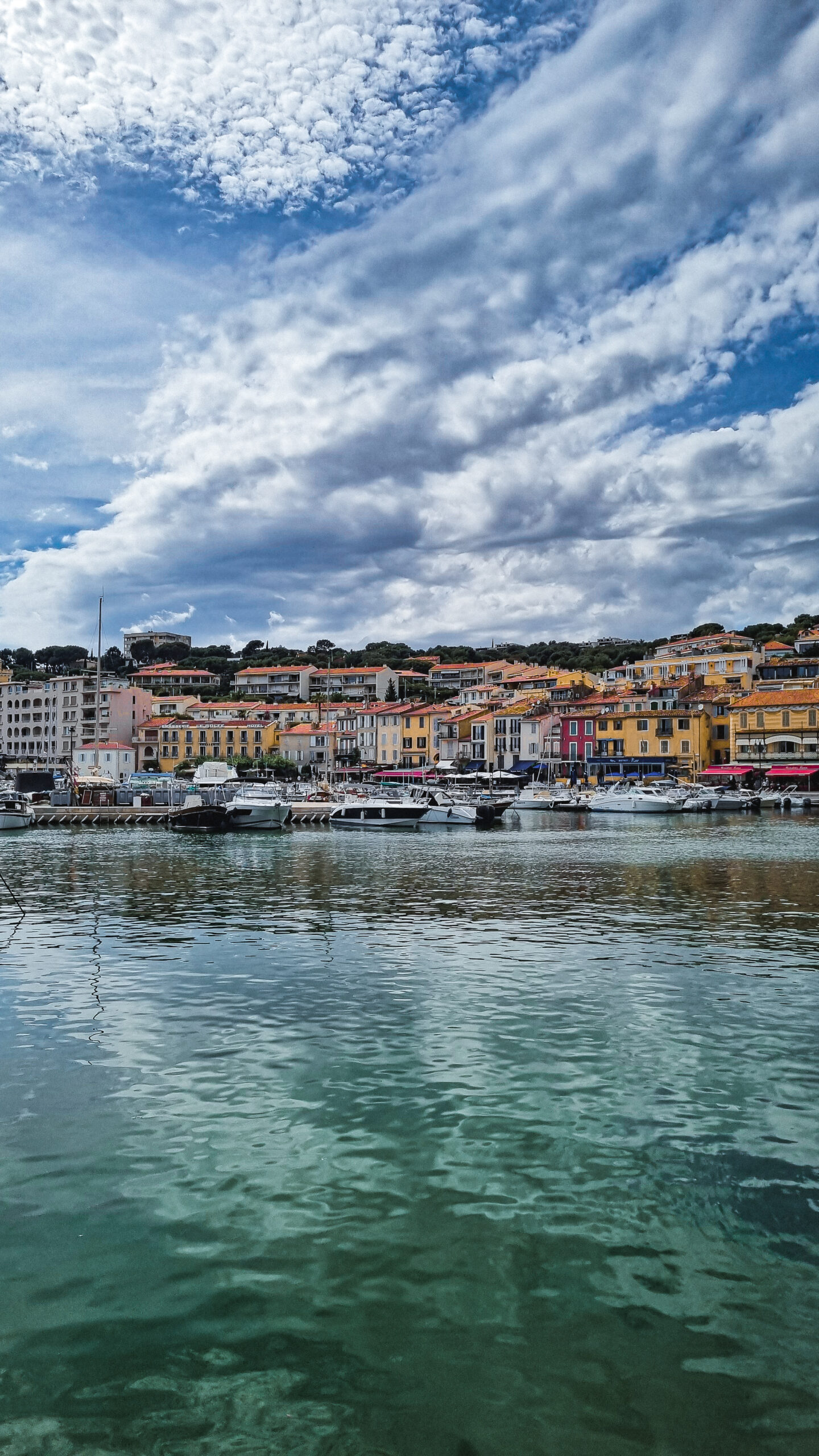 Several boats docked in the picturesque old port town of Cassis in the South of France.