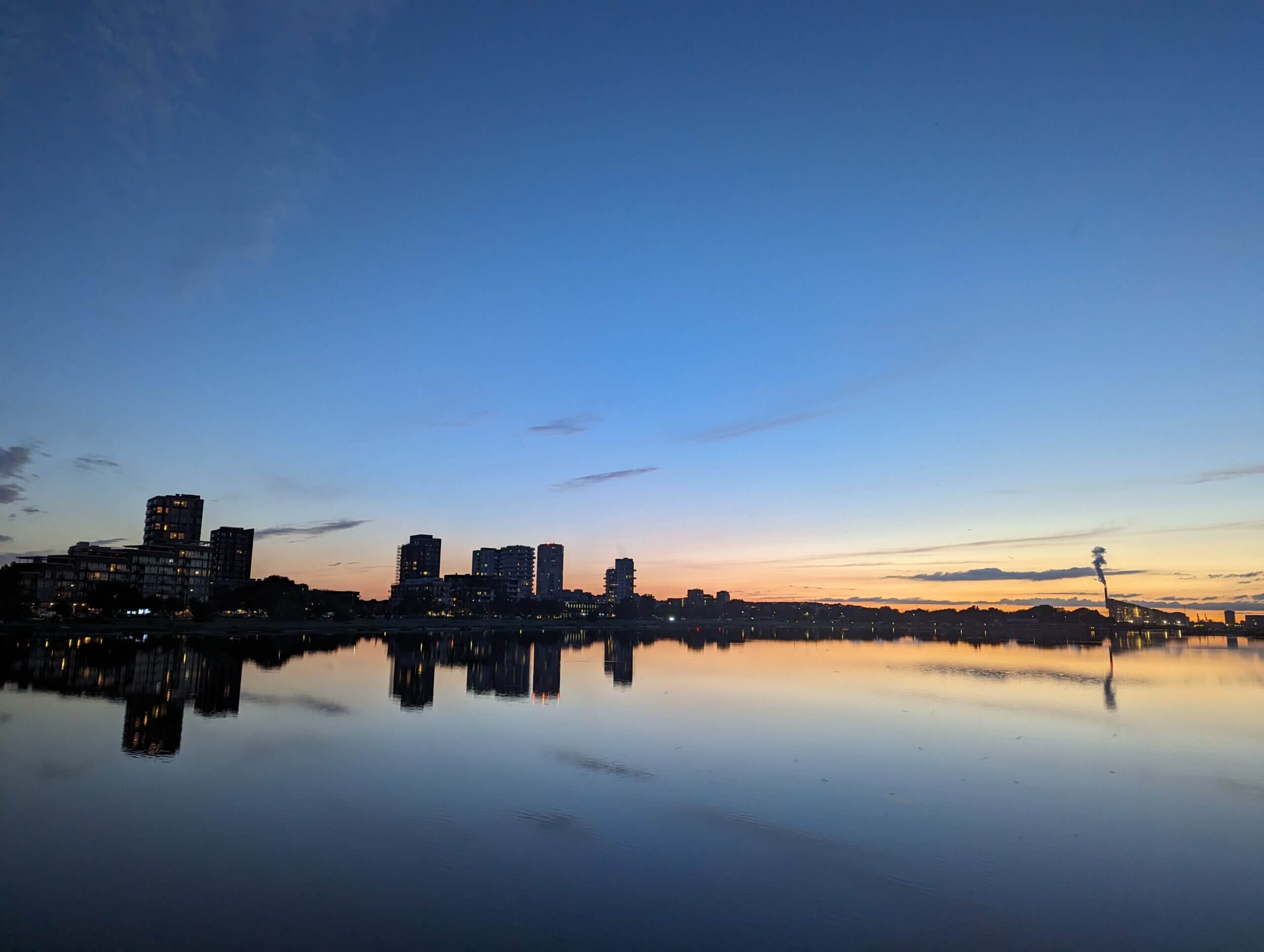 An incredible cityscape sunset over a lake in Copenhagen, Denmark.